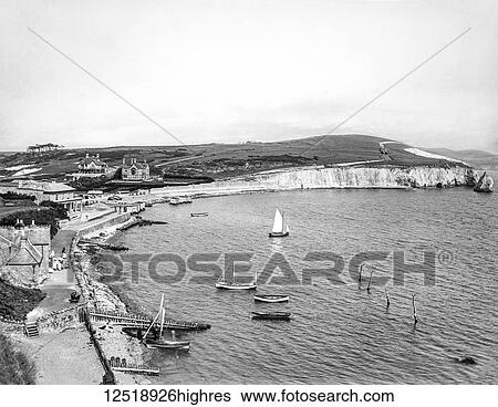 Stock Photograph - Magic lantern slide circa 1900. Victorian/Edwardian. Social History. Freshwater is a large village and civil parish at the western end of the Isle of Wight, England. Freshwater Bay is a small cove on the south coast of the Island which also gives its.... Fotosearch