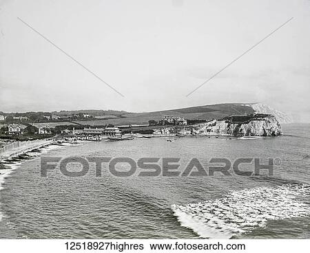 Stock Photograph - Magic lantern slide circa 1900. Victorian/Edwardian. Social History. Freshwater is a large village and civil parish at the western end of the Isle of Wight, England. Freshwater Bay is a small cove on the south coast of the Island which also gives its.... Fotosearch