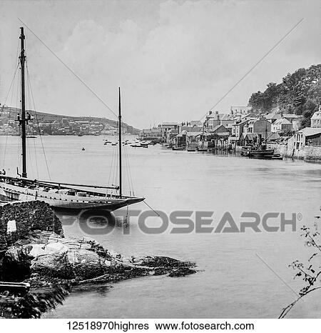 Magic lantern slide circa 1900. Victorian/Edwardian. Social History. Fowey Harbour Cornish: Fowydh, meaning 'Beech Trees) is a small town, civil parish and cargo port at the mouth of the River Fowey in south Cornwall, England, United Kingdom. The town... View Large Photo Image Stock Photograph - Magic lantern slide circa 1900. Victorian/Edwardian. Social History. Fowey Harbour Cornish: Fowydh, meaning 'Beech Trees) is a small town, civil parish and cargo port at the mouth of the River Fowey in south Cornwall, England, United Kingdom. The town.... Fotosearch