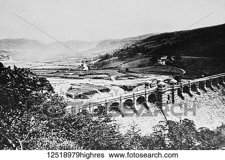 Stock Photograph - Magic lantern slide circa 1900. Victorian/Edwardian. Social History. Lake Vyrnwy (Welsh: Llyn Efyrnwy, pronounced [??v? rn??] or Llyn Llanwddyn) being built in the 1880s. A reservoir in Powys, Wales, built in the 1880s to supply Liverpool with fresh.... Fotosearch