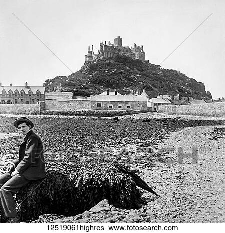 Stock Photograph - Magic lantern slide circa 1900. Victorian/Edwardian. Social History. ST Michaels Mount Cornwall, England. St Michael's Mount (Cornish: Karrek Loos yn Koos, [1] meaning hoar rock in woodland)[2] is a small tidal island in Mount's Bay, Cornwall, England,.... Fotosearch