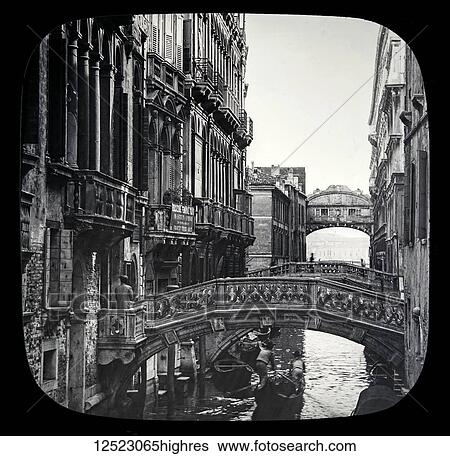 Stock Photograph - Magic lantern slide circa 1900. Victorian/Edwardian. Social History. The Beauties of Venice, photographs created in 1888 Joseph John William ACWORTH F. I. C., F. C. S. J. The Beauties of Venice. Along the Canal leading to Bridge of Sighs. This view shows us.... Fotosearch