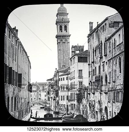 Stock Photograph - Magic lantern slide circa 1900. Victorian/Edwardian. Social History. The Beauties of Venice, photographs created in 1888 Joseph John William ACWORTH F. I. C., F. C. S. J. The Beauties of Venice. Re-entering the Grand Canal, passing onwards towards the.... Fotosearch