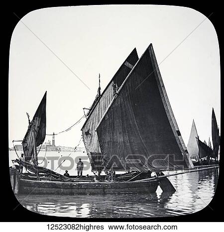 Stock Photograph - Magic lantern slide circa 1900. Victorian/Edwardian. Social History. The Beauties of Venice, photographs created in 1888 Joseph John William ACWORTH F. I. C., F. C. S. J. The Beauties of Venice. Fishing Boats. In this view we have a number of fishing.... Fotosearch