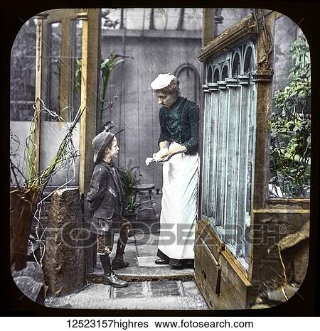 Stock Photograph - Magic lantern slide circa 1900. Victorian/Edwardian. Social History. Mrs Isabel Reaney story of Willie Wills Wings and slide show a christian story. Life model painted background. Slide 9 One day he had been offering some combs for sale at a house. Fotosearch