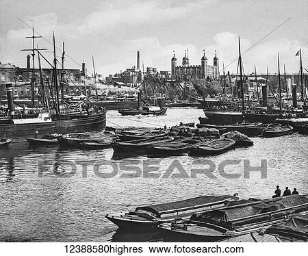 Stock Photograph - Magic Lantern slide circa 1900 views of London, England in Victorian times. Looking across the thames towards the Toer of London. Barges, Steam Ships and other boats on the Thames. Fotosearch