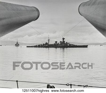 Stock Photograph - Magic lantern slide. War images. Battle ship HMS Hood. HMS Hood (pennant number 51) was the last battlecruiser built for the Royal Navy. Commissioned in 1920, she was named after the 18th-century Admiral Samuel Hood. One of four Admiral-class.... Fotosearch