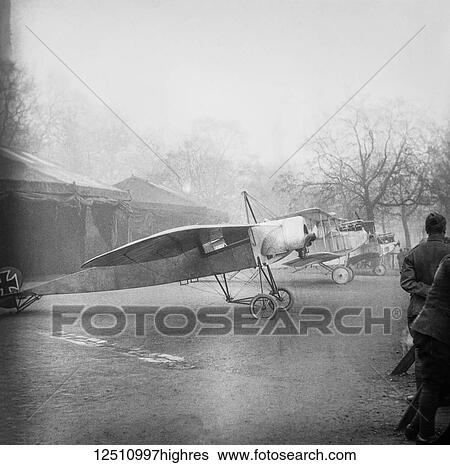 Stock Photograph - Magic lantern slide WW1, 1914-1918, World war one images. German Fokker aircaraft, single wing and bi plane. Display of captured German weapons and artillary at Horse Guards Parade, London 3rd November 1915.. Fotosearch
