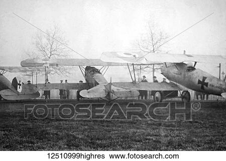 Stock Photograph - Magic lantern slide WW1, 1914-1918, World war one images. Captured German Fokker aircraft in a field. Display of captured German weapons and artillary at Horse Guards Parade, London 3rd November 1915.. Fotosearch