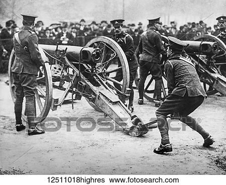 Stock Photograph - Magic lantern slide WW1, 1914-1918, World war one images. British Gunners demonstate placing and manouvering of a gun. Fotosearch