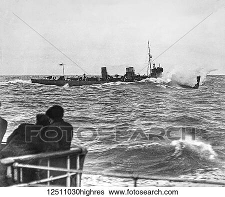 Stock Photograph - Magic lantern slide WW1, 1914-1918, World war one images. Royal Navy torpedo boat escorting a channel steam merchant ship.. Fotosearch