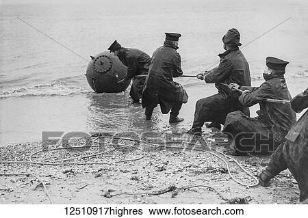 Magic lantern slide WW2, 1939-1946, World war two images. Training sailors from HMS Victory in Portsmouth, dragging a mine ashore to defuse. 5 Cadets with a long rope attached to a sea mine View Large Photo Image Stock Photograph - Magic lantern slide WW2, 1939-1946, World war two images. Training sailors from HMS Victory in Portsmouth, dragging a mine ashore to defuse. 5 Cadets with a long rope attached to a sea mine. Fotosearch