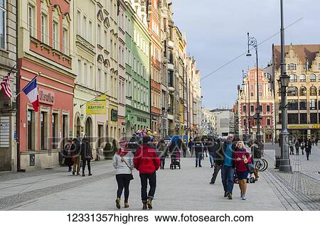 Stock Photograph - Main Market Square With Old Buildings And People Strolling; Wroclaw, Lower Silesia, Poland. Fotosearch