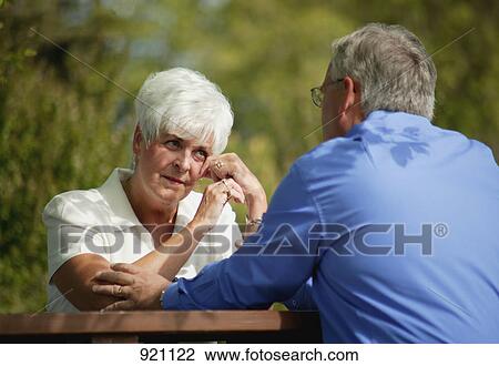Stock Image - Man comforting woman. Fotosearch