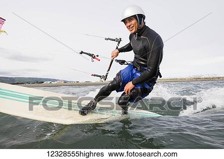 Man kitesurfing in Kachemak Bay, South-central Alaska; Homer, Alaska, United States of America View Large Photo Image Stock Photograph - Man kitesurfing in Kachemak Bay, South-central Alaska; Homer, Alaska, United States of America. Fotosearch
