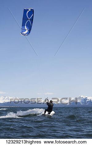Man kitesurfing near Homer, South-central Alaska; Alaska, United States of America View Large Photo Image Stock Photograph - Man kitesurfing near Homer, South-central Alaska; Alaska, United States of America. Fotosearch