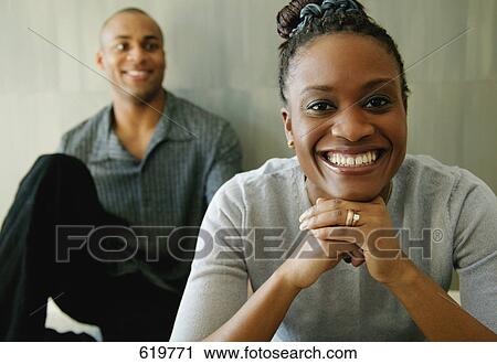 Stock Image - Man looks at woman. Fotosearch
