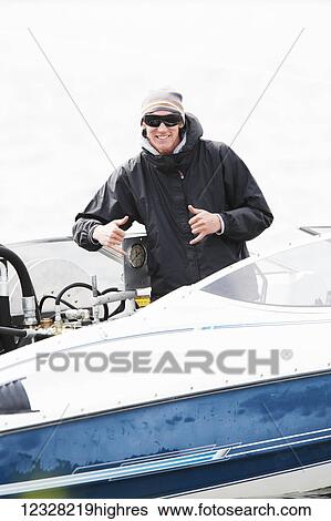 Man On A Motorboat Giving Paragliding Instruction, Alaska, USA View Large Photo Image Stock Photograph - Man On A Motorboat Giving Paragliding Instruction, Alaska, USA. Fotosearch