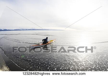 Man sea kayaking in Kachemak Bay, South-central Alaska; Homer, Alaska, United States of America View Large Photo Image Stock Photograph - Man sea kayaking in Kachemak Bay, South-central Alaska; Homer, Alaska, United States of America. Fotosearch