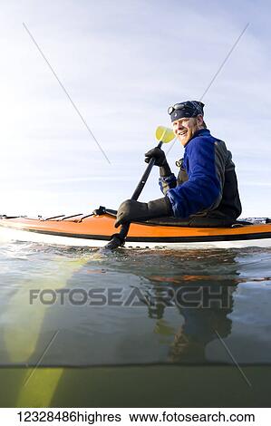 Man sea kayaking in Kachemak Bay, South-central Alaska; Homer, Alaska, United States of America View Large Photo Image Stock Photograph - Man sea kayaking in Kachemak Bay, South-central Alaska; Homer, Alaska, United States of America. Fotosearch