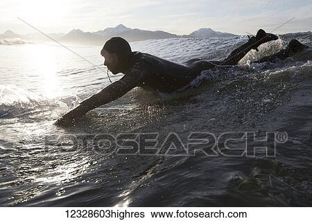 Man surfing, South-central Alaska; Homer, Alaska, United States of America View Large Photo Image Stock Photograph - Man surfing, South-central Alaska; Homer, Alaska, United States of America. Fotosearch