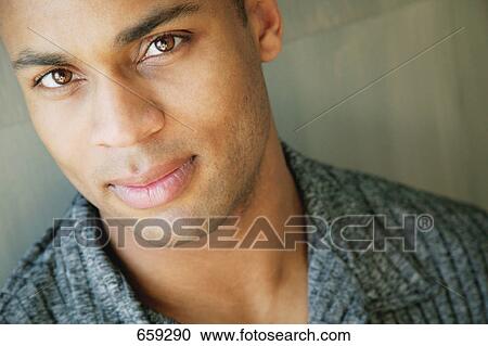 Stock Image - Man with brown eyes. Fotosearch