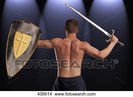 Picture - Man with sword and shield. Fotosearch