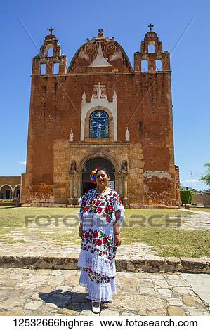 Mayan woman in traditional dress standing outside the Church of San Antonio de Padua, a former convent; Ticul, Yucatan, Mexico View Large Photo Image Stock Photograph - Mayan woman in traditional dress standing outside the Church of San Antonio de Padua, a former convent; Ticul, Yucatan, Mexico. Fotosearch