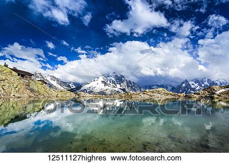 Mont Blanc Massif reflecting on Lac Blanc; Chamonix-Mont-Blanc, Haute-Savoie, France View Large Photo Image Stock Photograph - Mont Blanc Massif reflecting on Lac Blanc; Chamonix-Mont-Blanc, Haute-Savoie, France. Fotosearch