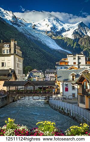 Mont Blanc over Chamonix town and L'Arve River with flowers; Chamonix-Mont-Blanc, Haute-Savoie, France View Large Photo Image Stock Photograph - Mont Blanc over Chamonix town and L'Arve River with flowers; Chamonix-Mont-Blanc, Haute-Savoie, France. Fotosearch