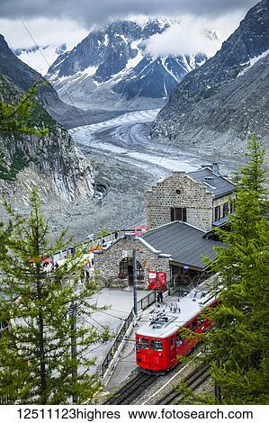 Montenvers train at Mer de Glace Station overlooks glacier and Grandes Jorasses; Chamonix-Mont-Blanc, Haute-Savoie, France View Large Photo Image Stock Photograph - Montenvers train at Mer de Glace Station overlooks glacier and Grandes Jorasses; Chamonix-Mont-Blanc, Haute-Savoie, France. Fotosearch
