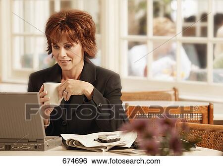 Stock Photograph - Morning e mail check. Fotosearch