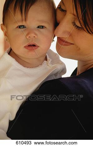 Mother holds baby View Large Photo Image Stock Image - Mother holds baby. Fotosearch