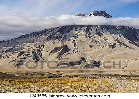 Stock Photograph - Mt. Griggs rises above the ash- and pumice-covered Valley of Ten Thousand Smokes in Katmai National Park; Alaska, United States of America. Fotosearch