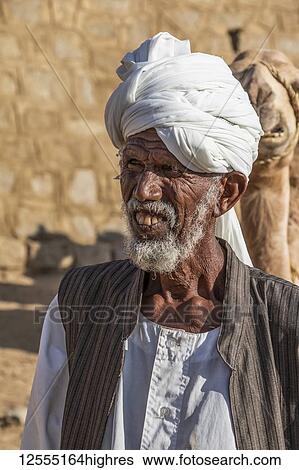 Stock Photograph - Old camel herder at the Monday livestock market; Keren, Anseba Region, Eritrea. Fotosearch