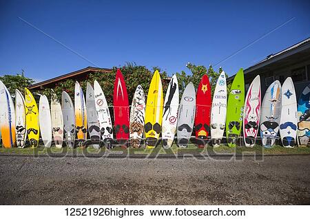 Stock Photograph - Old surfboards make for a creative fence; Paia, Maui, Hawaii, United States of America. Fotosearch