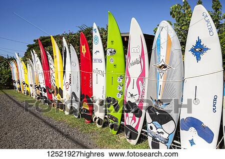 Stock Photograph - Old surfboards make for a creative fence; Paia, Maui, Hawaii, United States of America. Fotosearch