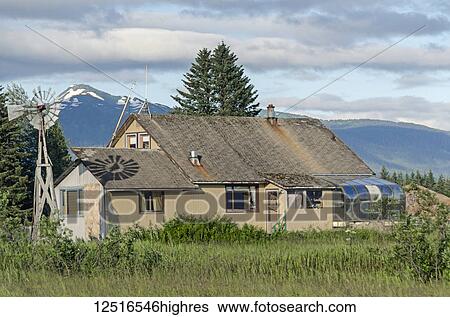 Older house with windmill tripod and solarium, Southeast Alaska; Gustavus, Alaska, United States of America View Large Photo Image Stock Photograph - Older house with windmill tripod and solarium, Southeast Alaska; Gustavus, Alaska, United States of America. Fotosearch