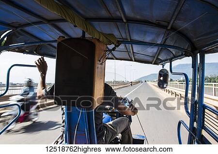 Stock Photograph - On board a tuk-tuk; Pakse, Champasak, Laos. Fotosearch