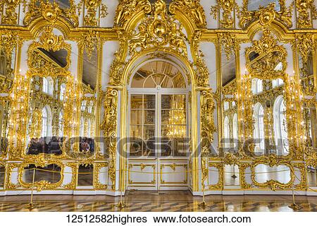 Stock Photograph - Ornate decorative walls in gold designs in the Great Hall, Catherine Palace; Tsarskoye Selo, Pushkin, Russia. Fotosearch