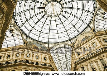 Stock Photograph - Ornate glass ceiling in luxury mall, Galleria Vittorio Emanuele Il; Milan, Italy. Fotosearch