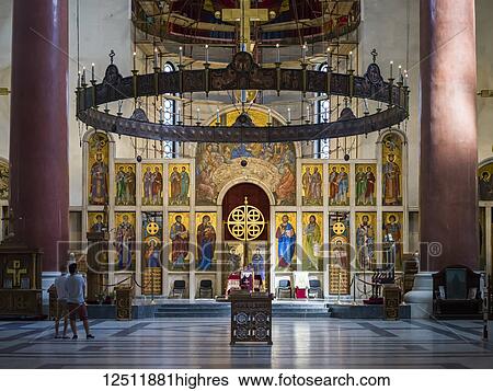 Stock Photograph - Ornate interior and tourists inside St. Mark's Church, a Serbian Orthodox Church in Tasmajdan Park; Belgrade, Vojvodina, Serbia. Fotosearch