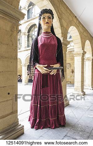 Paper mache figure of a woman in a long dress, Gigantes and Cabezudos; Bilbao, Vizcaya, Pais Vasco, Spain View Large Photo Image Stock Photograph - Paper mache figure of a woman in a long dress, Gigantes and Cabezudos; Bilbao, Vizcaya, Pais Vasco, Spain. Fotosearch