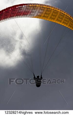 Stock Photograph - Paraglider Overhead, Alaska, USA. Fotosearch
