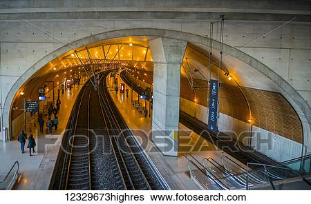 Passengers Waiting On The Platform Beside The Tracks In A Train Station; Monte Carlo, Monaco View Large Photo Image Stock Photograph - Passengers Waiting On The Platform Beside The Tracks In A Train Station; Monte Carlo, Monaco. Fotosearch