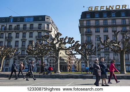 Pedestrians Walking On The Geneva Waterfront; Geneva, Switzerland View Large Photo Image Stock Photograph - Pedestrians Walking On The Geneva Waterfront; Geneva, Switzerland. Fotosearch