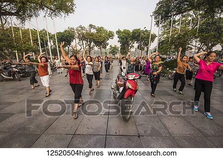People exercising in the early morning; Hoan Kiem, Hanoi, Vietnam View Large Photo Image Stock Photograph - People exercising in the early morning; Hoan Kiem, Hanoi, Vietnam. Fotosearch