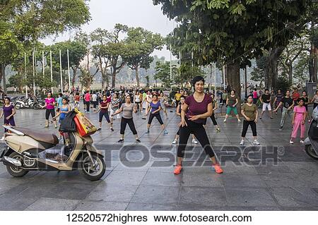 Stock Photograph - People exercising in the early morning; Hoan Kiem, Hanoi, Vietnam. Fotosearch