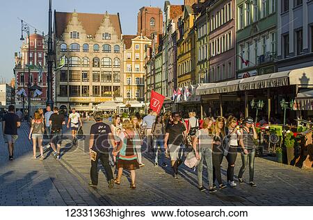 Stock Photograph - People Strolling In The Main Market Square In Late Afternoon; Wroclaw, Lower Silesia, Poland. Fotosearch
