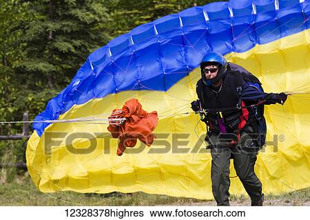 Person In A Paragliding Instruction Class, Southcentral Alaska, USA View Large Photo Image Stock Photograph - Person In A Paragliding Instruction Class, Southcentral Alaska, USA. Fotosearch